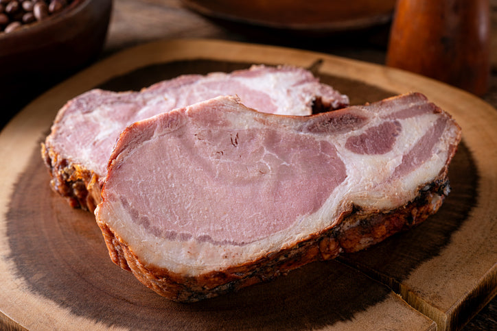 Two smoked pork chops on plate, fully cooked and ready to eat