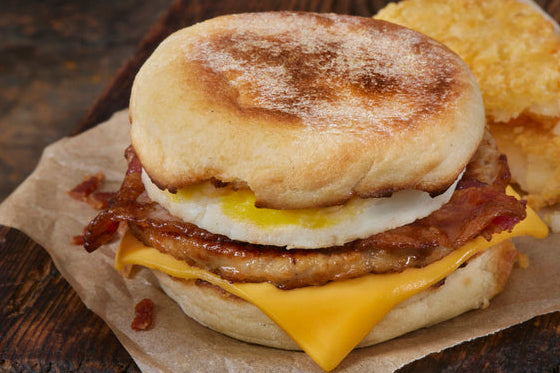 Close-up of breakfast sandwich with cooked bulk breakfast sausage on toasted muffin