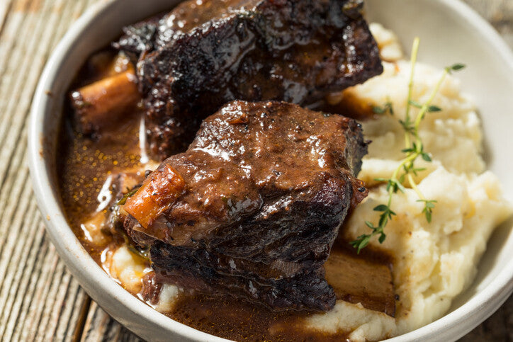 Red wine braised grassfed beef short ribs served over mashed potatoes, made with pasture-raised beef from Indiana