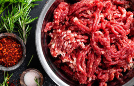Raw grassfed ground sirloin in metal bowl, 90/10 lean ratio from pasture-raised cattle