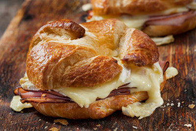 Melty baked ham and cheese croissant, filled with sliced ham from Tyner Pond Farm