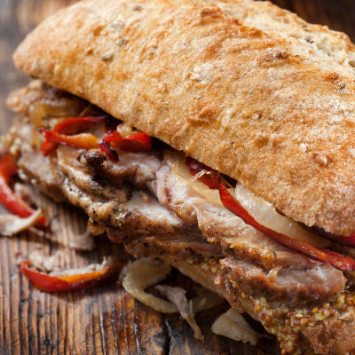 Hot pork tenderloin sandwich with crusty roll, made from cubed tenderloin