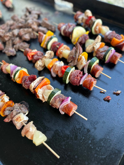 Grassfed beef skirt steak cut into kabobs and grilled with vegetables