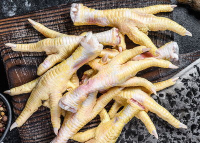 Pile of raw chicken feet from pasture-raised birds, labeled for pet use only, Tyner Pond Farm