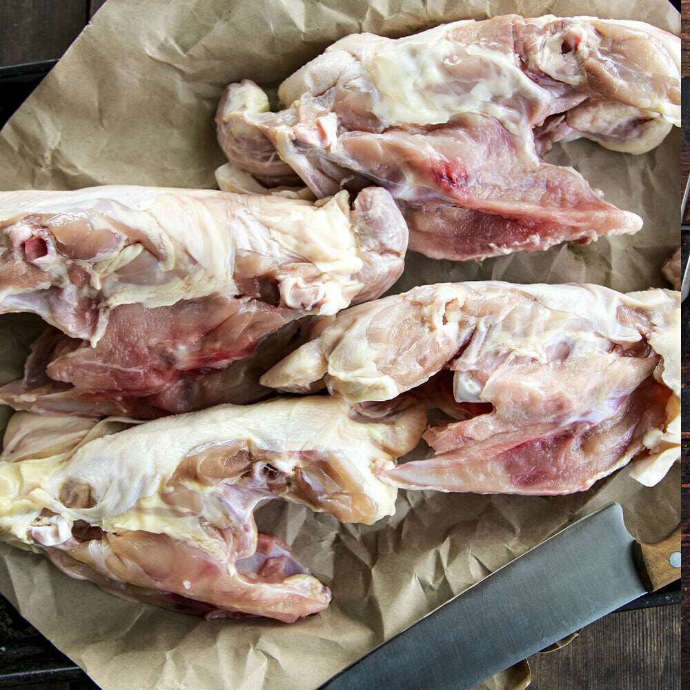 Raw chicken frames on butcher paper, from pasture-raised birds at Tyner Pond Farm