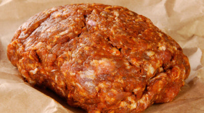 Raw ground chorizo on butcher paper, made from Gunthorp Farms pastured pork