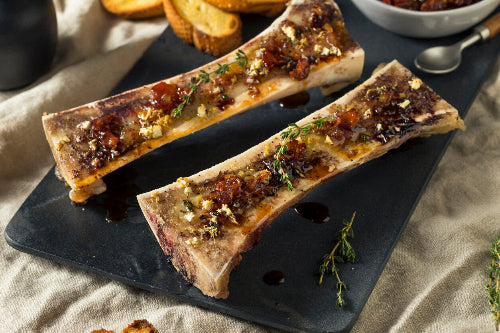 Roasted canoe-cut beef marrow bones with herbs, served as steak topping, from grassfed cattle at Tyner Pond Farm