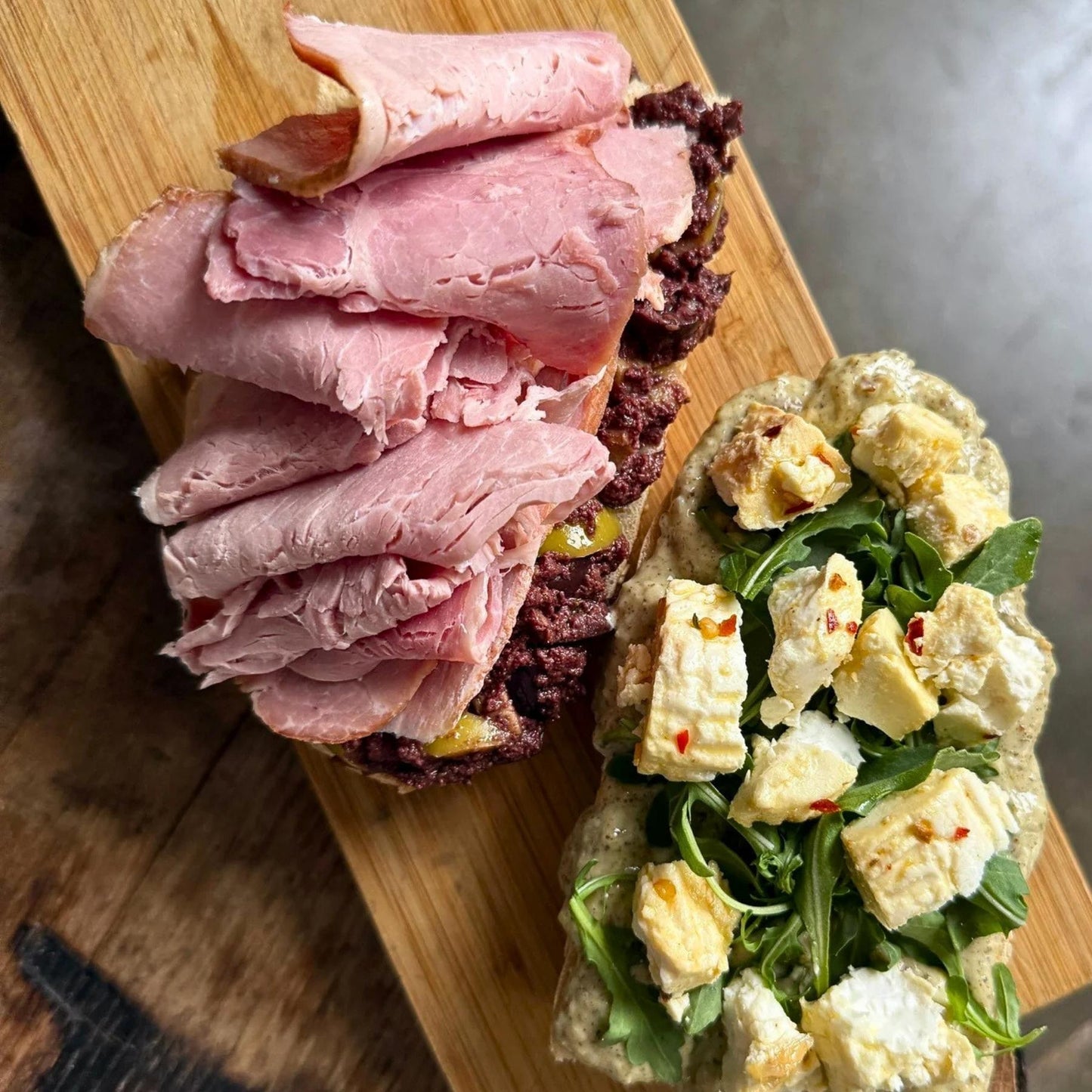 Smoking Goose City Ham sliced ham served on a sandwich, available through Tyner Pond Farm