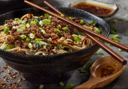 Ground pork stir-fry with vegetables in wok, cooked from local pork