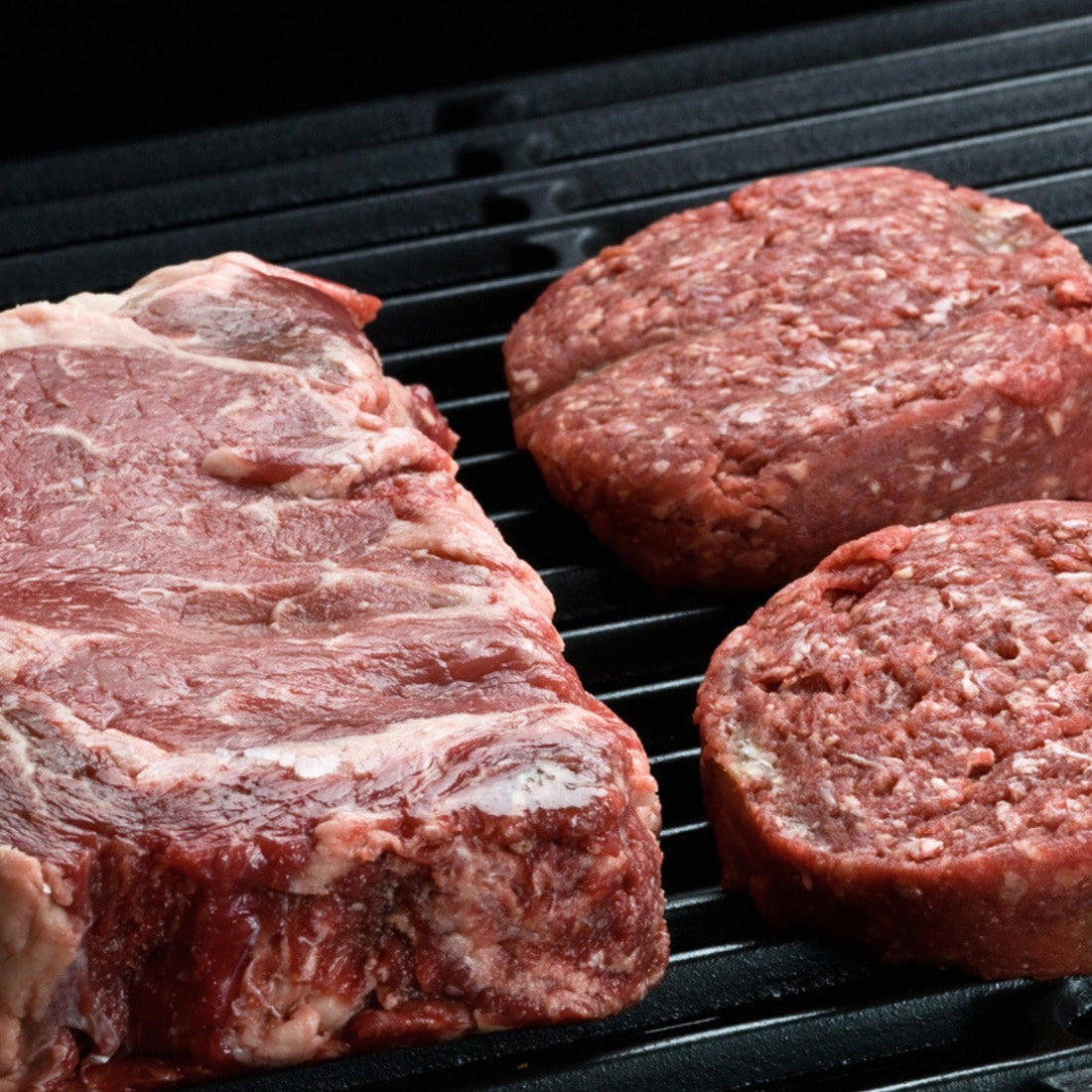 Grassfed Steak and Burgers on a grill for B12 absorption