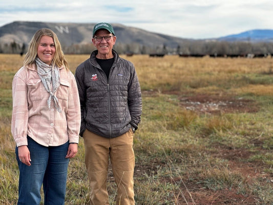 Cloe Parker, young CEO of Parker Pastures in Gunnison, Colorado, standing with a visitor in her high mountain pasture, committed to regenerative and holistic ranching practices.