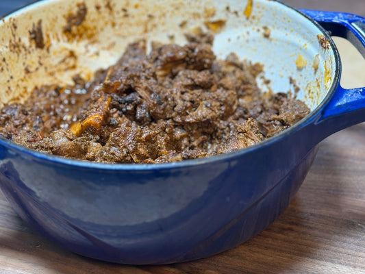 Dutch oven filled with Carne con Hígado — a traditional Mexican beef stew thickened with chicken liver, made with Tyner Pond Farm beef.