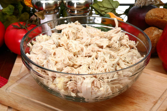 A bowl of shredded pasture-raised chicken from Tyner Pond Farm, ready to be used in various recipes.