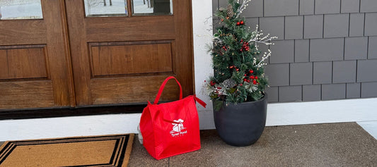 A tyner Pond Farm Red Bag On A Front Porch