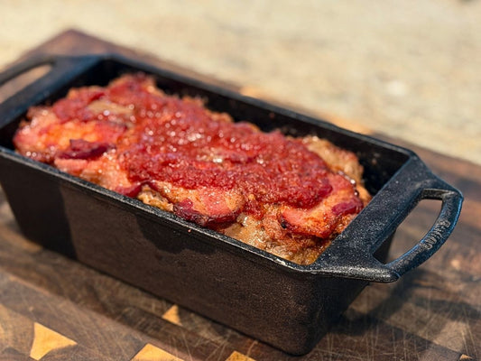 keto meatloaf made with Tyner Pond Farm grassfed beef in a cast iron loaf pan topped with bacon