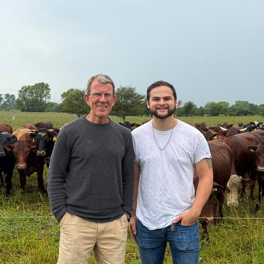 Evan Smith visiting grass-fed cattle at Tyner Pond Farm before seasonal beef processing in Indiana
