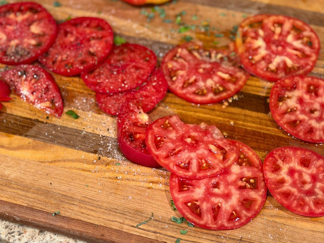 Two different tomato varieties from a Central Indiana produce farm showing how locally grown food can vary in color, texture, moisture, and structure.