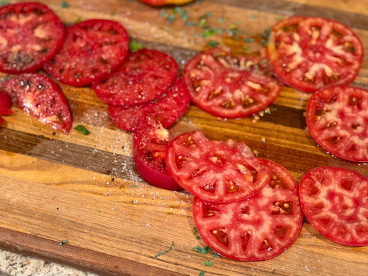 Two different tomato varieties from a Central Indiana produce farm showing how locally grown food can vary in color, texture, moisture, and structure.