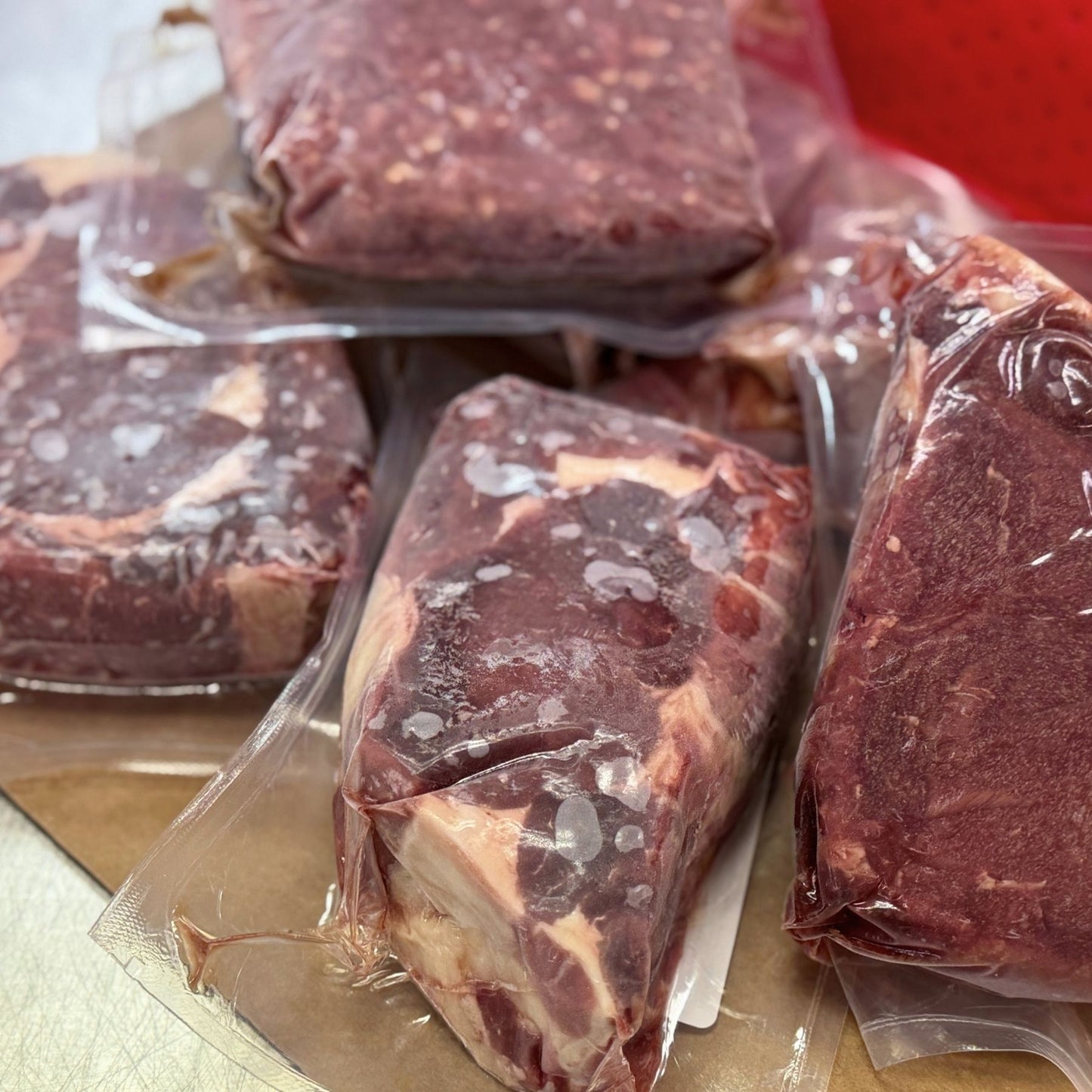 100% grassfed and grass-finished beef bundle from Tyner Pond Farm with ribeye steaks, New York strips, and ground beef, vacuum-sealed for local delivery in central Indiana.