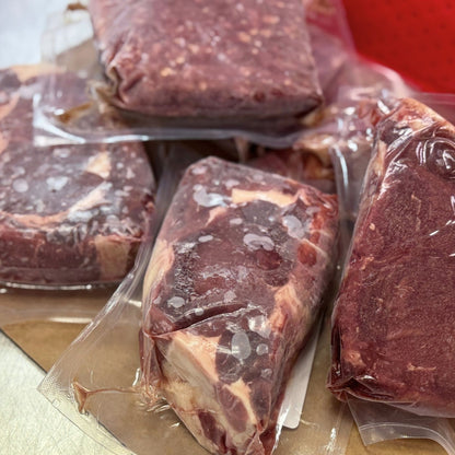 100% grassfed and grass-finished beef bundle from Tyner Pond Farm with ribeye steaks, New York strips, and ground beef, vacuum-sealed for local delivery in central Indiana.