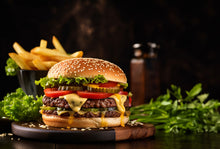 Cooked grassfed beef burger on bun with lettuce, made from pasture-raised beef at Tyner Pond Farm