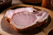 Two smoked pork chops on plate, fully cooked and ready to eat