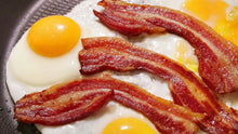 Top-down view of bacon and eggs on plate, made with all-natural bacon from Tyner Pond Farm