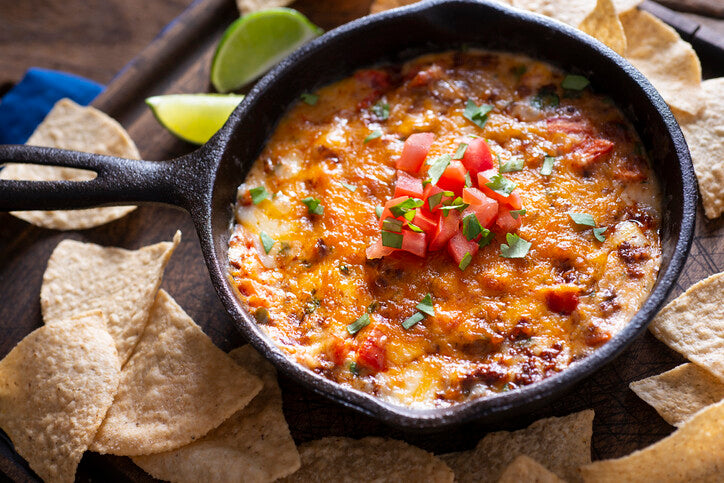 Top-down view of choriqueso in cast iron skillet, made with pastured pork chorizo from Gunthorp Farms