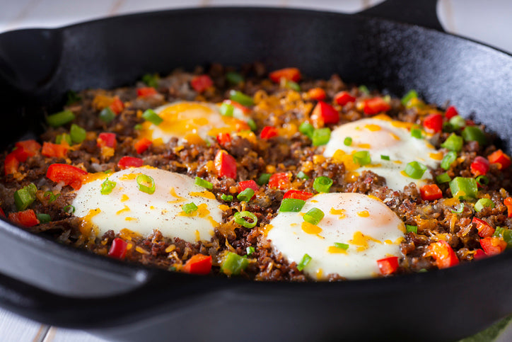 Cast iron skillet with chorizo, peppers, and eggs made from local pork sausage