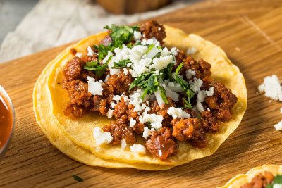 Taco with ground chorizo, cilantro, and onion, using Tyner Pond Farm sausage