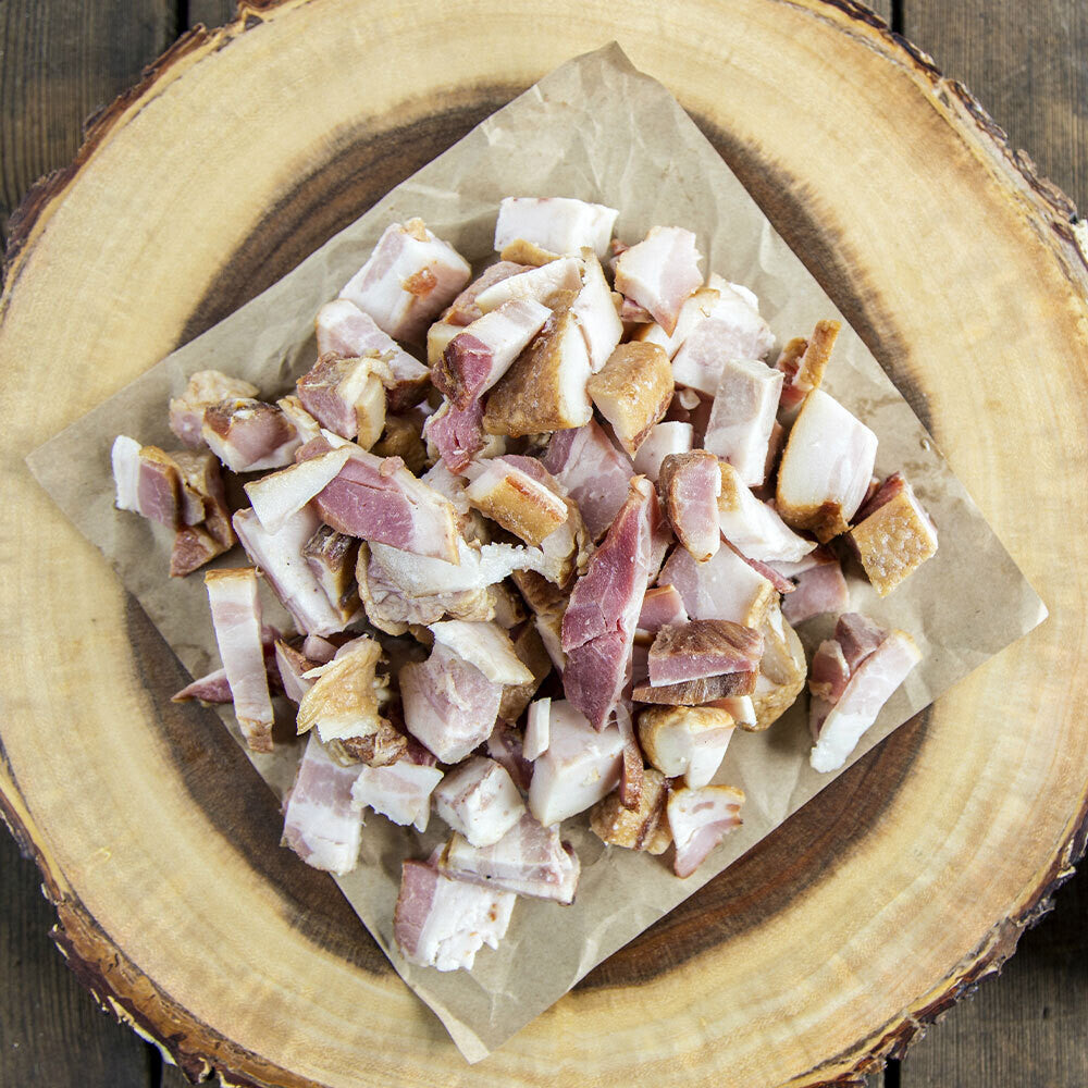 Diced ham pieces on butcher paper, fully cooked and ready to use