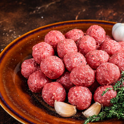 Raw grassfed ground round rolled into meatballs, 93/7 lean, pasture-raised at Tyner Pond Farm
