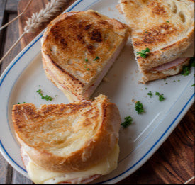 Grilled ham and cheese sandwich with shaved ham, top-down view