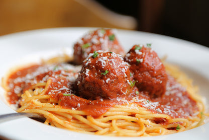 Spaghetti and meatballs made with ground pastured pork Italian sausage