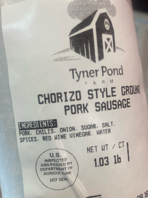 Packaged chorizo pork sausage showing label and ingredients, not vacuum-sealed