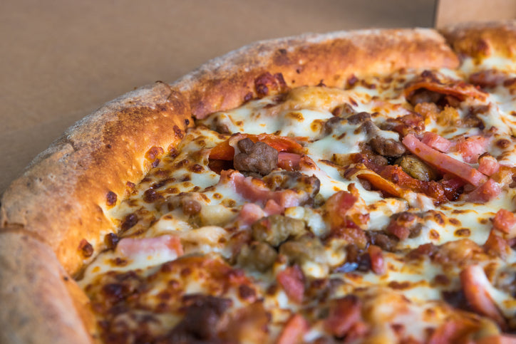 Pizza topped with Italian sausage made from Gunthorp Farms pastured pork