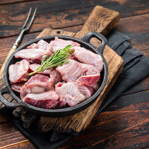 Raw chicken gizzards on cutting board, pasture-raised organ meat from Tyner Pond Farm