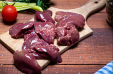 Raw pasture-raised chicken livers on cutting board, ready for cooking, from Tyner Pond Farm