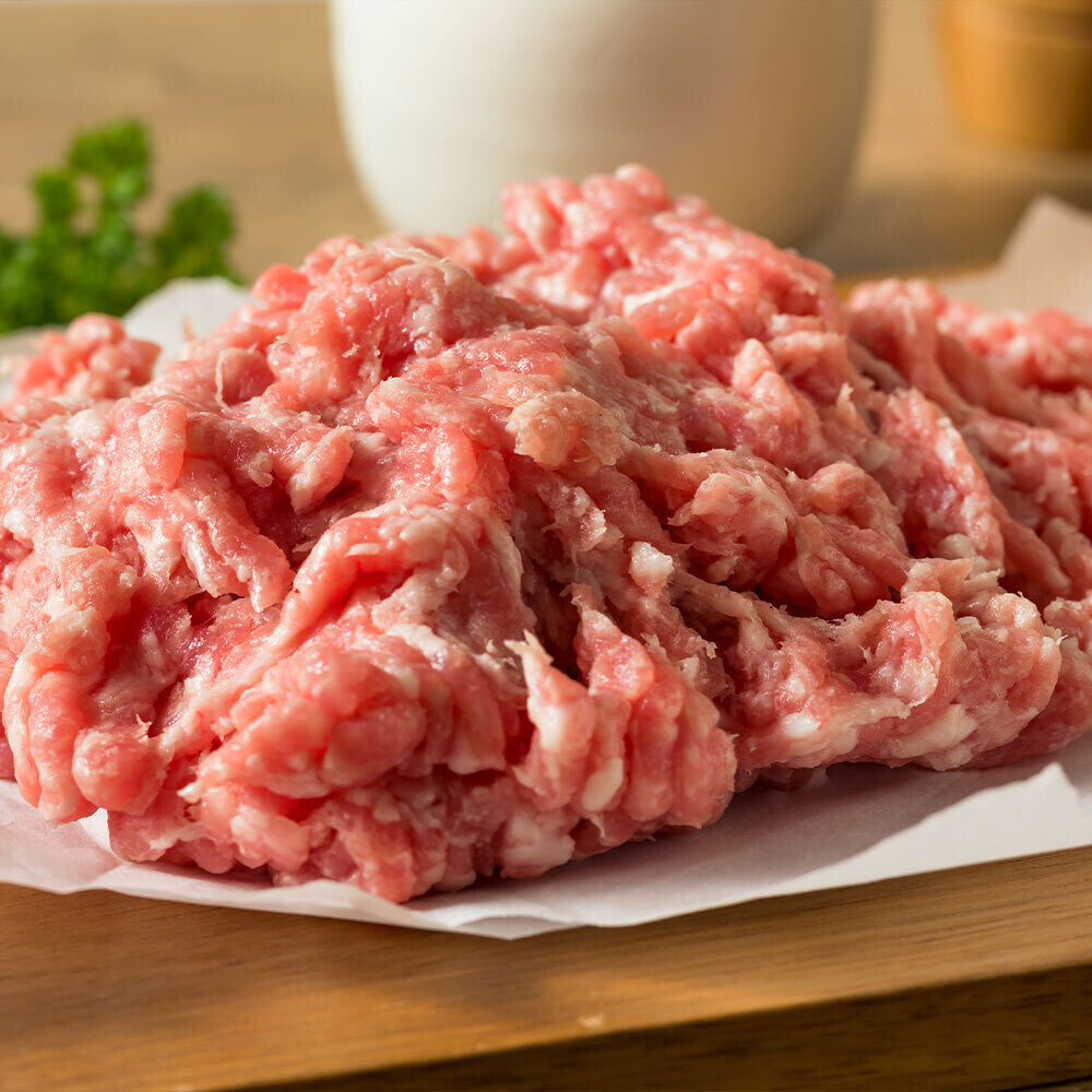 Raw ground pork on butcher paper, local unseasoned pork from Tyner Pond Farm