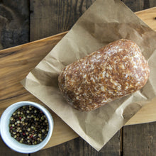 Raw hot pork sausage on butcher paper, bulk-style and ready to cook