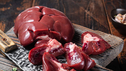 Raw grassfed beef kidney on butcher paper, whole and unprocessed