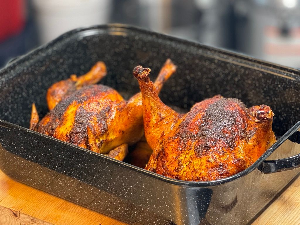 Whole pasture-raised chicken roasted with crisp skin, resting after cooking