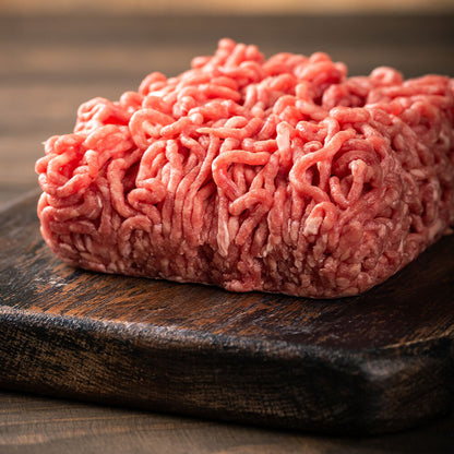 side view of raw ground chuck, grassfed and grass-finished, ready to cook