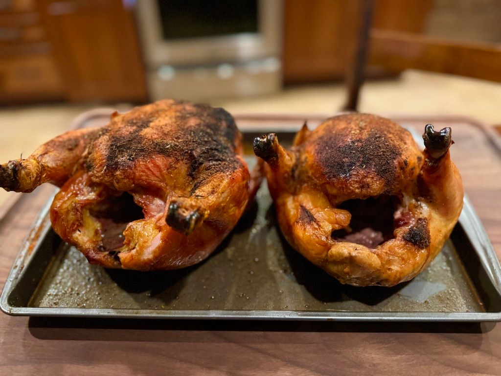 Side view of golden brown whole chicken, roasted from pasture-raised bird