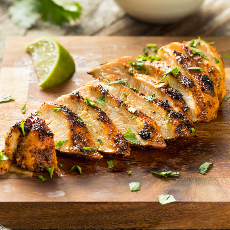 Sliced cooked chicken breast from pasture-raised bird, ready to serve