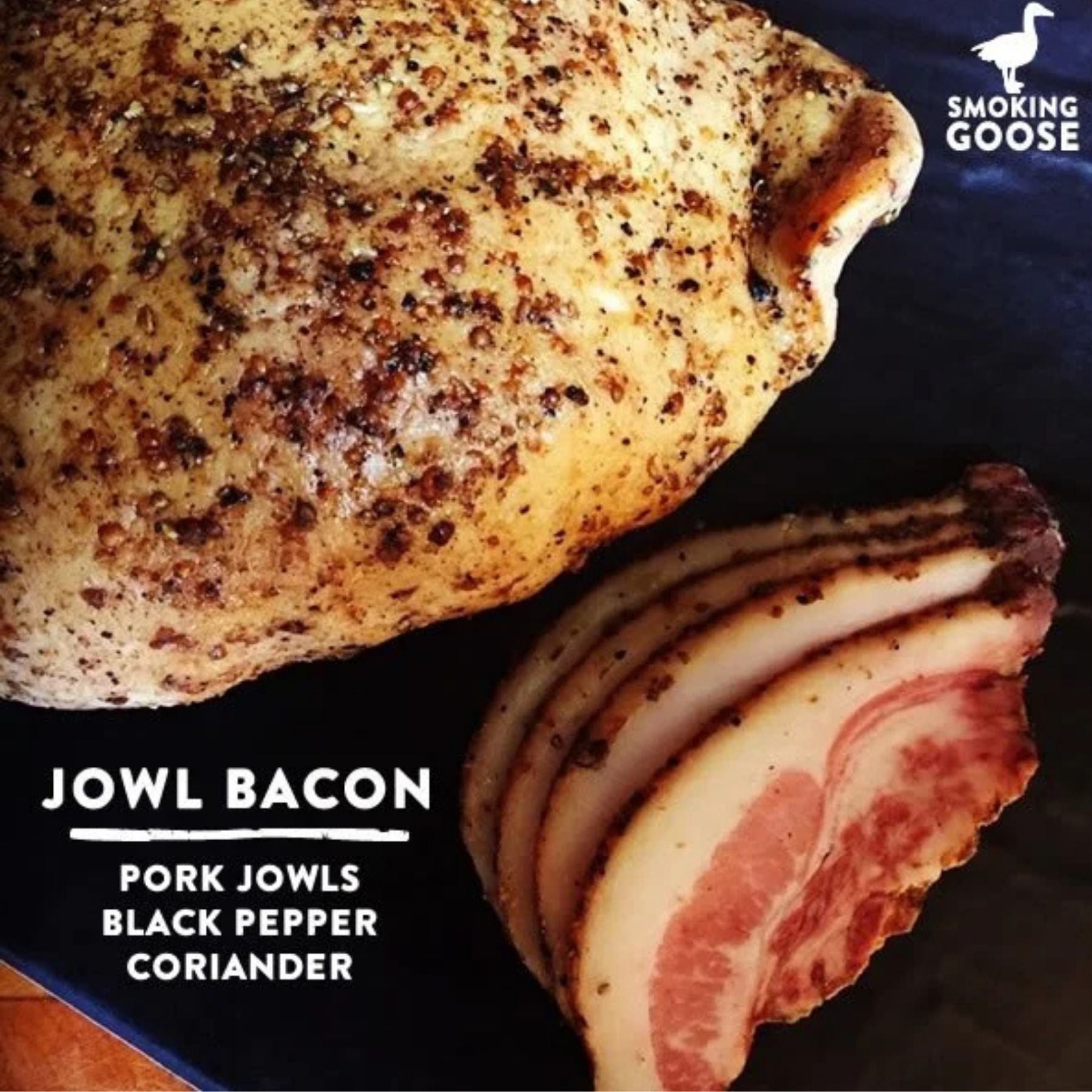 Smoking Goose Jowl Bacon made from pork jowls, dry-rub cured with black pepper and coriander, and smoked over apple wood